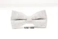Detailed shot of the grey herringbone wool bow tie showing texture and fabric craftsmanship. - YM-008