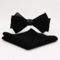 Close-up detail of black velvet bow tie and pocket square set for formal evening events. - Style B / Black