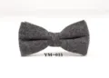 Detail view of dark grey wool bow tie, showing fine textured fabric and classic shape. - YM-015
