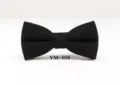 Close up detail of classic black wool bow tie, perfect for wedding and business suit. - YM-018