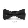 Detail view of the black men bow tie featuring a subtle skull and crossbones woven pattern. - KL-001 (Black)
