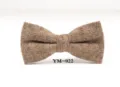 Detail shot of the brown wool bow tie, showing fine tweed texture and neat stitching. - YM-022