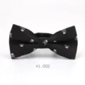 Detailed view of the black men bow tie featuring white skull pattern, close-up texture. - KL-002 (Black)
