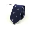 Men's navy blue narrow necktie featuring stylish white skull jacquard pattern for trendy wear. - Dark Blue