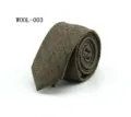 Detail view of a stylish wool plaid necktie showcasing fine texture and classic pattern. - WOOL-003