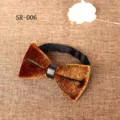Close-up detail view of the luxury brown velvet bow tie with leather center knot and strap. - Brown Mottled Texture Style (SR-006)