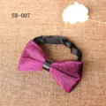 Close-up detail of magenta velvet bow tie with black leather center ring and adjustable neck strap. - Magenta Texture Style (SR-007)