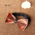 Velvet bow tie detail showing soft brown fabric texture and sleek black leather center knot. - Brown Print Style (SR-011)