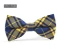 Detailed close-up of a blue and yellow plaid cotton bow tie with classic British style. - MG-106