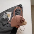 Pink bowling handbag with cute bear plush pendant, stylish small crossbody pillow bag for women. - With Pendant / Pink