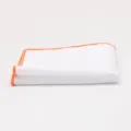 Close-up detail view of white men pocket square with orange trim, elegant suit accessory. - Orange Edge