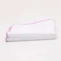 Detailed close-up of the white pocket square with pink stitched edge, premium suit accessory. - Light Purple Border