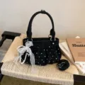 Black polka dot ruffled handbag with white pearl bow, soft leather crossbody bag variant. - With Pendant / Black