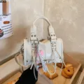 White women Boston crossbody bag, stylish PU leather handbag with straps for daily commute. - With Pendant / Off White