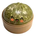 Cute green steamed bun squishy toy with gold glitter and happy face for stress relief. - Gold Sequin Pattern
