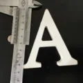 White wooden letter A decor prop, minimalist display piece, smooth finish, lightweight home accent. - White Letter A