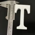 White wooden letter T ornament detail shot, minimalist decor prop for home and wedding display. - White Letter T