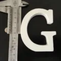 White wooden letter G detail shot, size measurement display with caliper for home and wedding decor. - White Letter G