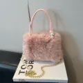 Pink plush handbag with pearl handle and gold chain strap, stylish fuzzy shoulder crossbody bag - Pink