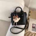 Black leather bucket bag with cute bear pendant, stylish crossbody handbag for women. - With Charm / Black