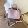 Pink leather bucket bag for women, stylish top handle shoulder bag with knots and strap. - No Pendant / Purple