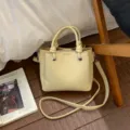 Yellow textured leather bucket bag for women, stylish casual crossbody handbag with knotted handles. - No Pendant / Yellow