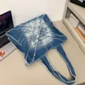 Women large denim shoulder bag, trendy commuter tote with stylish distressed patchwork design. - Light Blue