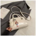 Compact cream white Boston shoulder bag, fashionable cross-body handbag with chic pearl pendant. - With Pendant / White
