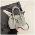 Grey bucket bag for women, stylish crossbody tote with woven texture and cute lock pendant. - With Pendant / Gray