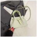 Light green textured bucket bag for women, niche design woven shoulder crossbody handbag. - No Pendant / Green