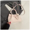 Pink woven bucket bag for women, stylish faux leather handbag with top handle and crossbody strap. - No Pendant / Pink