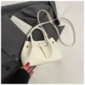 Women white woven crossbody bag stylish bucket handbag with top handle and belt buckle detail - No Pendant / White