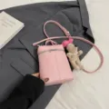 Ροζ τσάντα μίνι κουβά από PU δέρμα με λουρί χιαστί και χαριτωμένο λούτρινο κρεμαστό σκυλάκι. - Με Κρεμαστό / Ροζ