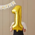 Gold number 1 foil balloon photo prop for kids 1st birthday party decoration and celebration layout. - 32-Inch Number 1 Gold Foil Balloon