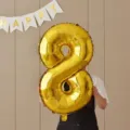 Gold number 8 foil balloon detail view, great for birthday party decoration props. - 32-Inch Gold Number 8 Balloon