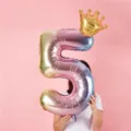 Detailed view of a rainbow gradient number 5 foil balloon with crown for kids party. - 32 Inch Rainbow Gradient Number 5 + 10 Inch Gold Crown