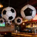 Inflatable soccer ball balloons for party and bar decoration, large hanging sports decor. - 5-Piece Mixed 4D and 18-Inch Set with Pump and Ribbon