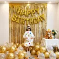 Birthday party balloon decoration set with gold fringe curtain and number balloons - Gold