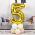 Gold number 5 foil balloon with pastel latex balloon base for birthday party decoration. - 40 Inch Gold Aluminum Foil Number Balloon 5
