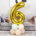 40-inch gold number 6 foil balloon with pastel latex balloon base, perfect for birthday party decorations. - 40 Inch Gold Aluminum Foil Number Balloon 6