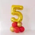Gold number 5 foil balloon with red and gold latex balloon base for birthday party decoration. - Gold Number 5 Balloon Column with Glue Dots and Ribbon