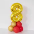 Gold number 8 foil balloon with red and gold latex balloons base for birthday party decor. - Gold Number 8 Balloon Column (Includes Glue Dots & Ribbon)