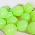 Bright lime green latex balloons for party decorations, birthdays, and festive events. - Matte Fruit Green