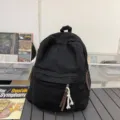 Sac à dos en toile unie, cartable de style collège décontracté et minimaliste en noir. - Noir