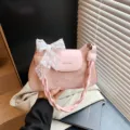 Pink underarm bag for women, stylish niche design shoulder bag with lace bow and braided handle. - Pink