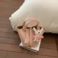 Pink leather bucket bag with cute knit rabbit pendant, stylish top handle handbag for women. - With Pendant / Pink