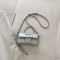 Chic grey women crossbody bag with statement buckle, elegant top handle and strap design. - With Pendant / Light Gray
