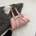 Pink PU leather shoulder bag for women, stylish lace-up design handbag and pillow commuter bag. - Pink