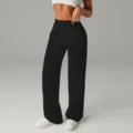 Detailansicht der hoch taillierten Plissee-Hose mit weitem Bein und elastischem Stoff. - S / Schwarz