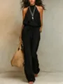 Chic black halter wide-leg jumpsuit for women, sleeveless Bohemian resort wear style. - S / Black